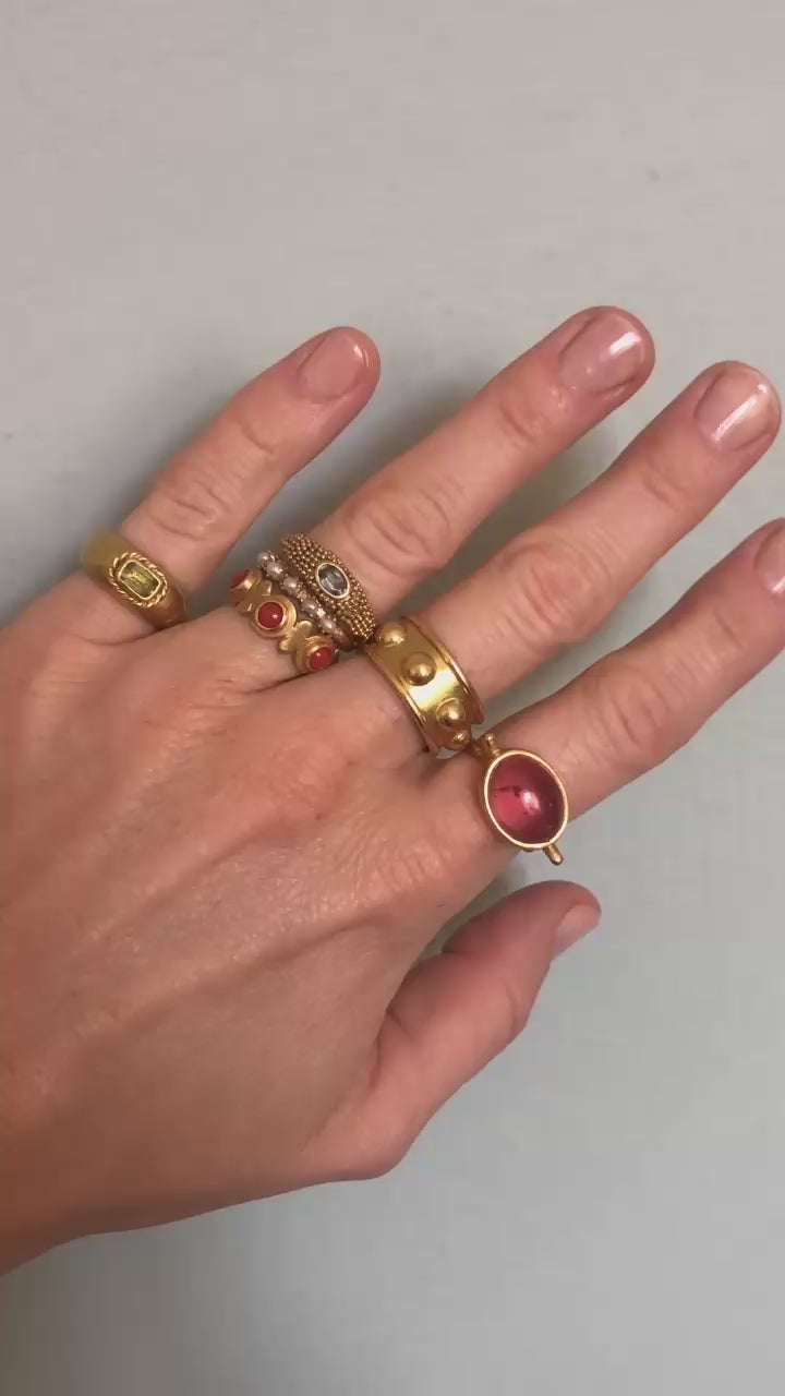 hand wearing gold rings moving